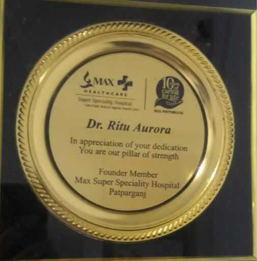Recognition presented to Dr. Ritu Aurora