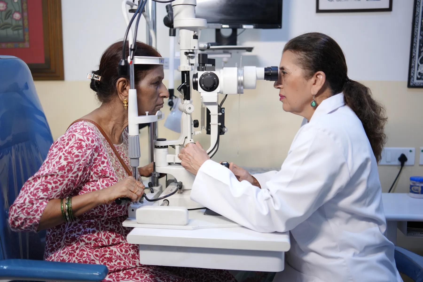 Eye specialist examining a patient at Vision Plus